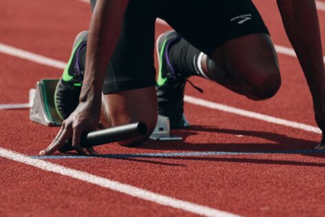 Athlete's legs on running start block.