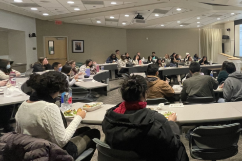 Class of students listen to lecture.